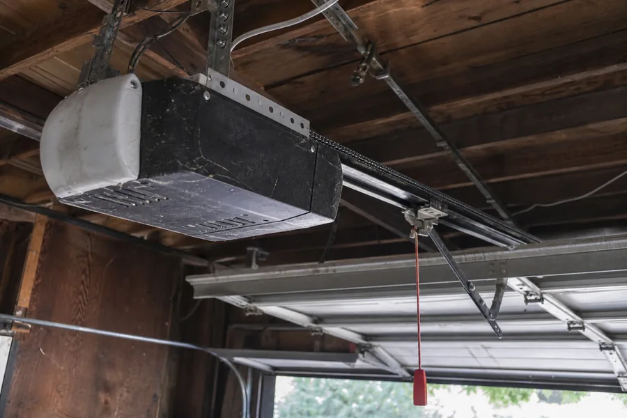 Opener and rail above an insulated two-car garage door