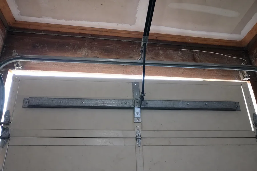 Reinforcement strut across the top panel of a double garage door in Rockford, IL