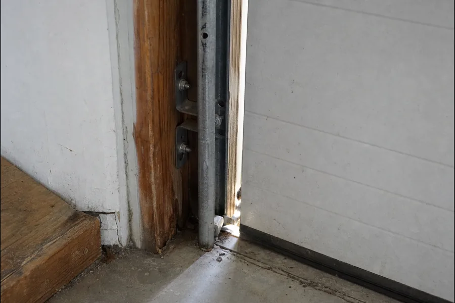 Vertical track and jamb brackets on a garage door in Rockford, IL